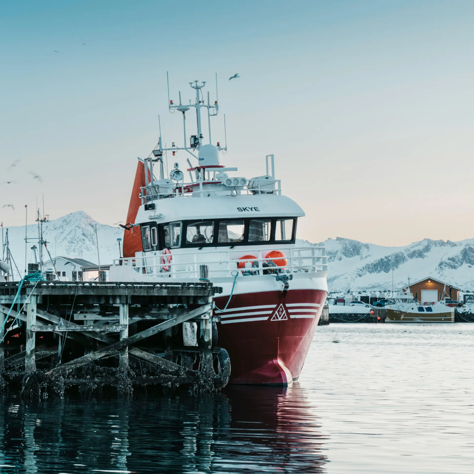 Norwegian fishing vessel moored at a quay in winter